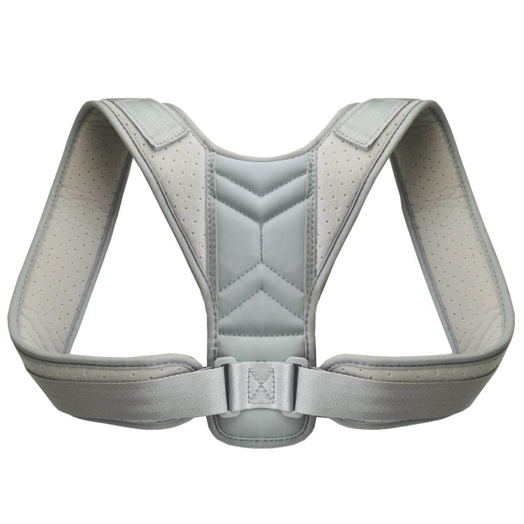 Correcteur de posture gris présenté seul, avec bretelles et boucle de réglage.