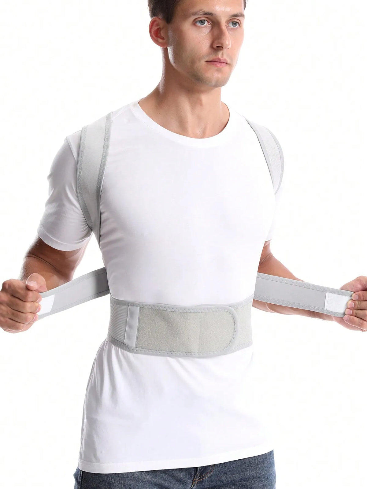 Correcteur blanc cassé porté de face, avec ceinture ouverte et sangles étirées sur les côtés.